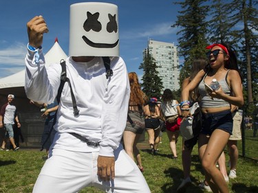 People in costume dance at FVDED in the PARK at Holland park in Surrey on July 2, 2016.