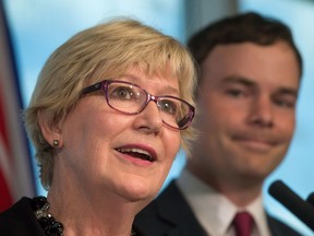 British Columbia Minister of Justice Suzanne Anton, left, announces the provincial government will amend human-rights legislation to protect transgender people, as NDP MLA Spencer Chandra Herbert listens during a news conference in Vancouver, B.C., on Wednesday July 20, 2016.