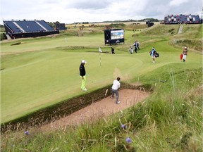 Thailand’s Thongchai Jaidee plays a shot out of ‘the Coffin,’ a rectangular bunker added in 1922 to the famed eighth hole — the Postage Stamp — at Royal Troon in Scotland on Tuesday. Royal Troon plays host to The Open championship on Thursday.