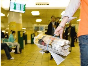 TORONTO, ONTARIO: SEPTEMBER 29, 2010 - Steve Meurice carries a bundle of National Post newspapers to be handed out by volunteers during Raise-A-Reader Day in Toronto, September 29, 2010.   (Tyler Anderson/National Post)  (For National) //NATIONAL POST STAFF PHOTO