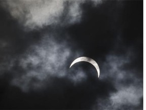 A total solar eclipse is seen from Palembang city on March 9, 2016 in Palembang, South Sumatra province, Indonesia. A total solar eclipse swept across Indonesia on Wednesday, seen by sky gazers and marked by parties, colourful tribal rituals and Muslim prayers.