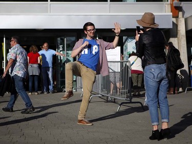 Fans gather to see Gord Downie, and the first stop of the Tragically Hip's Man Machine Poem Tour outside the Save-On-Foods Memorial Centre in Victoria, B.C., Friday, July 22, 2016.