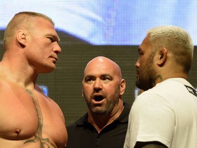UFC President Dana White speaks up as fighters as heavyweights Brock Lesnar (left) and Mark Hunt stare one another down during the weigh-in for UFC 200 last weekend. With the recent US $4-billion sale of the organization, White gets to cash out his initial minority stake and check back in as president on a five-year deal that will pay him nine per cent on all net profits.