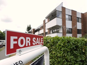 VANCOUVER, B.C.: AUGUST 08, 2012 --    Real estate signs adorn houses and condos sold and for sale in Vancouver, Wednesday, August 8, 2012.  ( Gerry Kahrmann /  PNG staff photo) ( For Sun News) [PNG Merlin Archive]