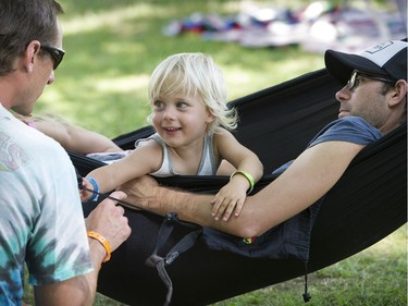 Grooving to it all-- Thousands took part in the 39th annual Vancouver Folk Festival in Jericho Beach Park in Vancouver on July 17, 2016.  Musicians from around the world performed at the dynamic and colourful festival. Here hanging out with Dad,  2 year old London Cardinal has some fun.