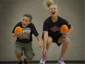 Dylan Uzelac, 11 and her eight-year-old brother Gabriel practice sports skills at a Fortius Kids Move class.