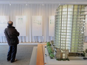 A buyer from Mainland China looks over condo plans at a White Rock sales centre.