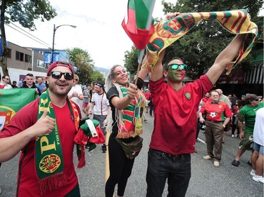 Jubilant Portuguese supporters celebrate on Vancouver's Commercial Drive after their team beat France to win the 2016 UEFA European Championship between Portugal and France, July 10, 2016.