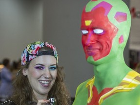 Lianne Moseley body paints a model at the International Make-up Artist Trade Show in Vancouver on Sunday.