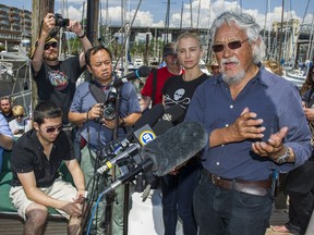 Canadian scientist David Suzuki speaks to the media Monday at Fisherman's Wharf in Vancouver. Canadian biologist Alexandra Morton will travel along major salmon migration routes and stop at various salmon farms to test for diseases and waste released by the farms.