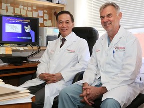 Dr. Jian Ye, left, and Dr. John Webb implanted the J-valve inside Johanna Eisenhuth, 88, to fix her leaky aortic valve. The valve has not been approved by Health Canada but Eisenhuth was given a special exemption as she would have been too frail to undergo open-heart surgery.