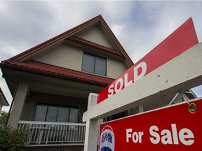 A house for sale with a sold sign in Vancouver.