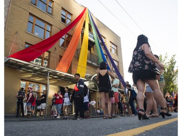 A Pride banner drapes over a building on Davie st for theTake back the streets for Pride Weekend, Vancouver, July 29 2016.