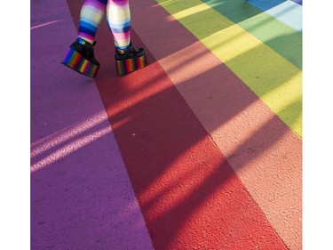 Ginger Mayell walks across the Pride sidewalk at theTake back the streets for Pride Weekend in the heart of the Davie Street Village, Vancouver, July 29 2016.