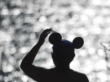 Kay Linan adjusts her Mickey Mouse ears as she waits for the fireworks display from team USA Disney at the Honda Celebration of Light in Vancouver, July 30 2016.