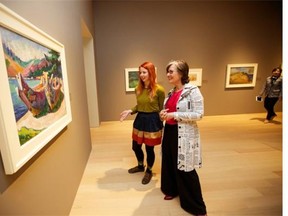 Viewers take in the Emily Carr exhibit at the soon-to-open Audain Art Museum.