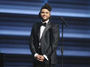 The Weeknd smiles at the 58th annual Grammy Awards on Monday, Feb. 15, 2016, in Los Angeles. (Photo by Matt Sayles/Invision/AP)
