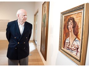 Michael Audain gazes at a 1927 portrait of his mother, Madeline Stulik by the English painter Augustus John.