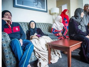 104-year-old Amona Ali with her family inside a hotel suite in Surrey, where she lives temporarily.