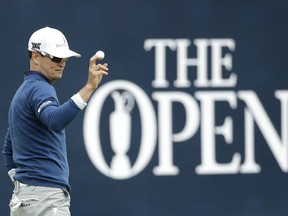 Zach Johnson of the United States acknowledges the crowd after putting on the 18th green during the final round of the British Open Golf Championship at the Royal Troon Golf Club in Troon, Scotland, Sunday, July 17, 2016.