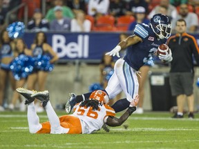 Toronto Argonauts Brandon Whitaker and BC Lions Solomon Elimimian during 1st half CFL action at BMO Field in Toronto, Ont. on Wednesday August 31, 2016. Ernest Doroszuk/Toronto Sun/Postmedia Network