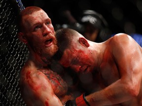 Conor McGregor (L) and Nate Diaz battle during their welterweight rematch at the UFC 202 event at T-Mobile Arena on August 20, 2016 in Las Vegas, Nevada. McGregor won by majority decision.