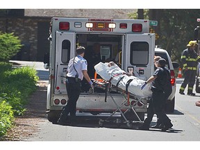 A person was loaded onto an ambulance after a fire in the 7600 block of 204th Street in Langley on Thursday, August 11, 2016.