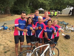 Ron Nalewajek, front centre, is flanked by his daughters Mara Nalewajek and Gina Whitaker and surrounded by other members of their team in the Ride to Conquer Cancer.