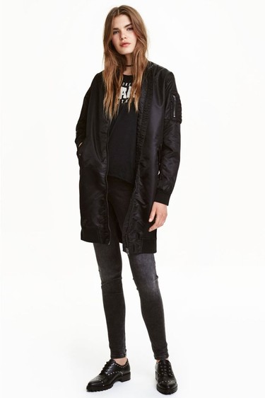 Basic black is anything but "basic" when it involves an on-trend oversized bomber jacket. A model wears a look from H&M including a Long Pilots Jacket, $69.99.