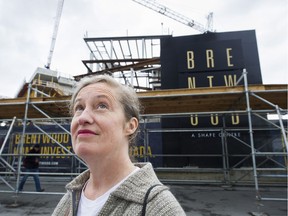 Helen Ward, chair of Burnaby First Coalition, looks at towers across the street from the Brentwood Mall development in Burnaby. The provincial Office of the Ombudsperson will investigate Burnaby's rezoning practices after a complaint from Ward.