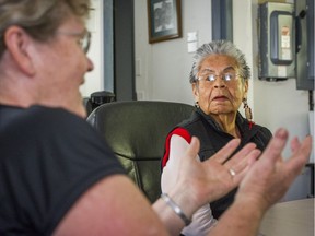 Elizabeth Phillips, the last fluent speaker of her Sto:lo people’s language, listens as Simon Fraser University linguistics adjunct professor Susan Russell makes a point at the Cheam Band office in Chilliwack last week.