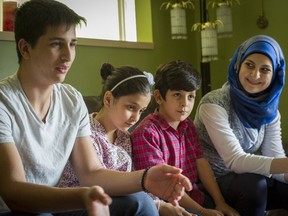 Shergo Kurdi, 15, Raezan Kurdi, 10, Ranim Kurdi, 8 and Heveen Kurdi, 16, are pictured in their aunt's home in Coquitlam last week.