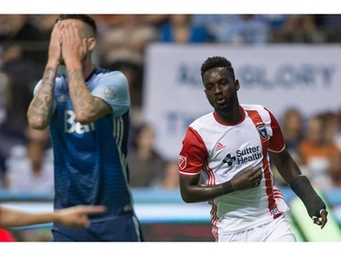 Vancouver Whitecaps' David Edgar, left, reacts after San Jose Earthquakes' Simon Dawkins, right, scored a goal during the second half of an MLS soccer game in Vancouver, B.C., on Friday August 12, 2016.