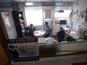 B.C. Civil Liberties Association Litigation Director Grace Pastine, left, and Executive Director Josh Paterson talk in his office, in Vancouver, B.C., on Thursday August 18, 2016. From a modest office tucked away in a corner of downtown Vancouver, the British Columbia Civil Liberties Association has made a big impact on the country's laws including changing how the terminally ill can get help from their doctors in ending their lives.