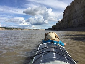 The day is calm and sunny and we drift down the right bank towards our second and final rapid of the journey - The Ramparts.