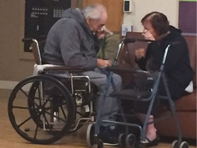 In this Monday, Aug. 22, 2016 photo provided by Ashley Bartyik, her grandparents Wolfram and Anita Gottschalk of Surrey, British Columbia, Canada, cry as they say goodbye near the end of a visit with each other in Wolfram's elderly care home in Surrey. The couple, who are in their 80s, were separated into two different care homes a half an hour apart after 62 years of marriage because no beds were available together. (Ashley Bartyik via AP) ORG XMIT: NY115