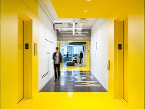 Elevators and stairways are all designed in LGM's corporate yellow in the company's new head office, to be visible from any point and encourage movement around the building. Photo courtesy of Ema Peter.