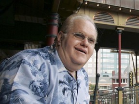 FILE- In this June 27, 2007, file photo Lou Pearlman poses outside his office's at Church Street Station in Orlando, Fla. Pearlman, credited for starting the boy-band craze and launching the careers of the Backstreet Boys and 'NSync, has died in prison while serving a 25-year sentence for a massive Ponzi scheme. The Orlando Sentinel reported that according to a federal inmate database, the 62-year-old Pearlman died Friday, Aug. 19, 2016.