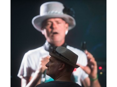 Lead singer Gord Downie is seen performing on a screen as a man watches during a viewing party for the final stop in Kingston, Ont., of a 10-city national concert tour by The Tragically Hip, in Vancouver, B.C., on Saturday August 20, 2016. Downie announced earlier this year that he was diagnosed with an incurable form of brain cancer.