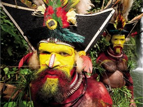 Men in New Guinea's Huli people of the Tari Valley take part in ceremony to become a man, after three years of seclusion. Photo credit (mandatory, must use: Taken from Wade Davis: Photographs, by Wade Davis, launching October 23. Published by Douglas & McIntyre)