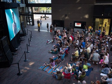 Lead singer Gord Downie is seen performing on a screen as people gather to watch during a viewing party for the final stop in Kingston, Ont., of a 10-city national concert tour by The Tragically Hip, in Vancouver, B.C., on Saturday August 20, 2016. Downie announced earlier this year that he was diagnosed with an incurable form of brain cancer.