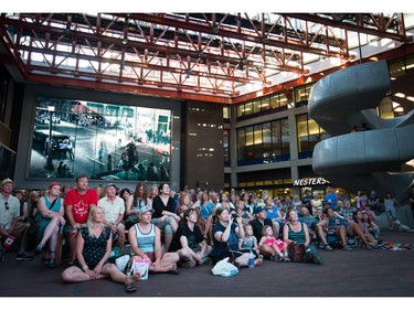 People gather for a viewing party for the final stop in Kingston, Ont., of a 10-city national concert tour by The Tragically Hip, in Vancouver, B.C., on Saturday August 20, 2016. Lead singer Gord Downie announced earlier this year that he was diagnosed with an incurable form of brain cancer.