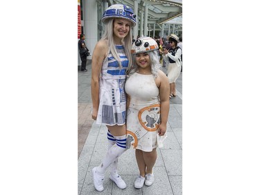 Laura Murray as R2D2, left and Clarisse De Guzman as BB8, right pose at Anime Revolution, a three-day convention of  activities, exhibits, panels and performances of the popular Japanese-born anime art form in Vancouver Sunday August 7, 2016.