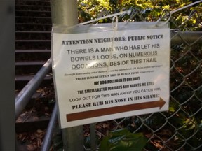 "Please rub his nose in his shame!" pleads the person who left this sign near a Saanich trail.