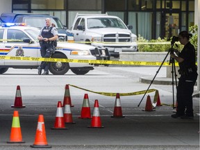 Police investigate a homicide at Shaughnessy Square at the corner of Flint Street and Coquitlam Avenue in Port Coquitlam, B.C. Sunday August 7, 2016.