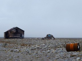 A long abandoned Hudson's Bay Company outpost is flanked by a cairn as well as a rusting oil barrel. Prince Leopold Island was inhabited as long ago as 1,500 years by Thule people, ancestors to the Inuit, and it remains an important fishing and hunting ground because of the abundant sea life here.
