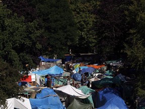 Residents at Tent City, also known as Super InTent City, are seen in Victoria, B.C., Tuesday, June 28, 2016.