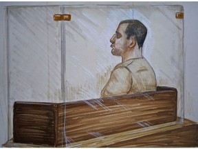 Reza Moazami is shown the prisoner's box in a Vancouver court, Sept.25, 2013 in this court drawing. Moazami, a British Columbia man who lured teenage girls into prostitution, has been convicted of 30 charges including human trafficking.