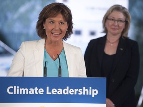 B.C. Premier Christy Clark at Friday’s news conference in Richmond announcing the province’s update to its climate plan, with Environment Minister Mary Polak in the background.