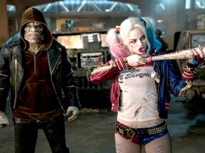 Adewale Akinnuoye-Agbaje and Margot Robbie in Suicide Squad (2016)